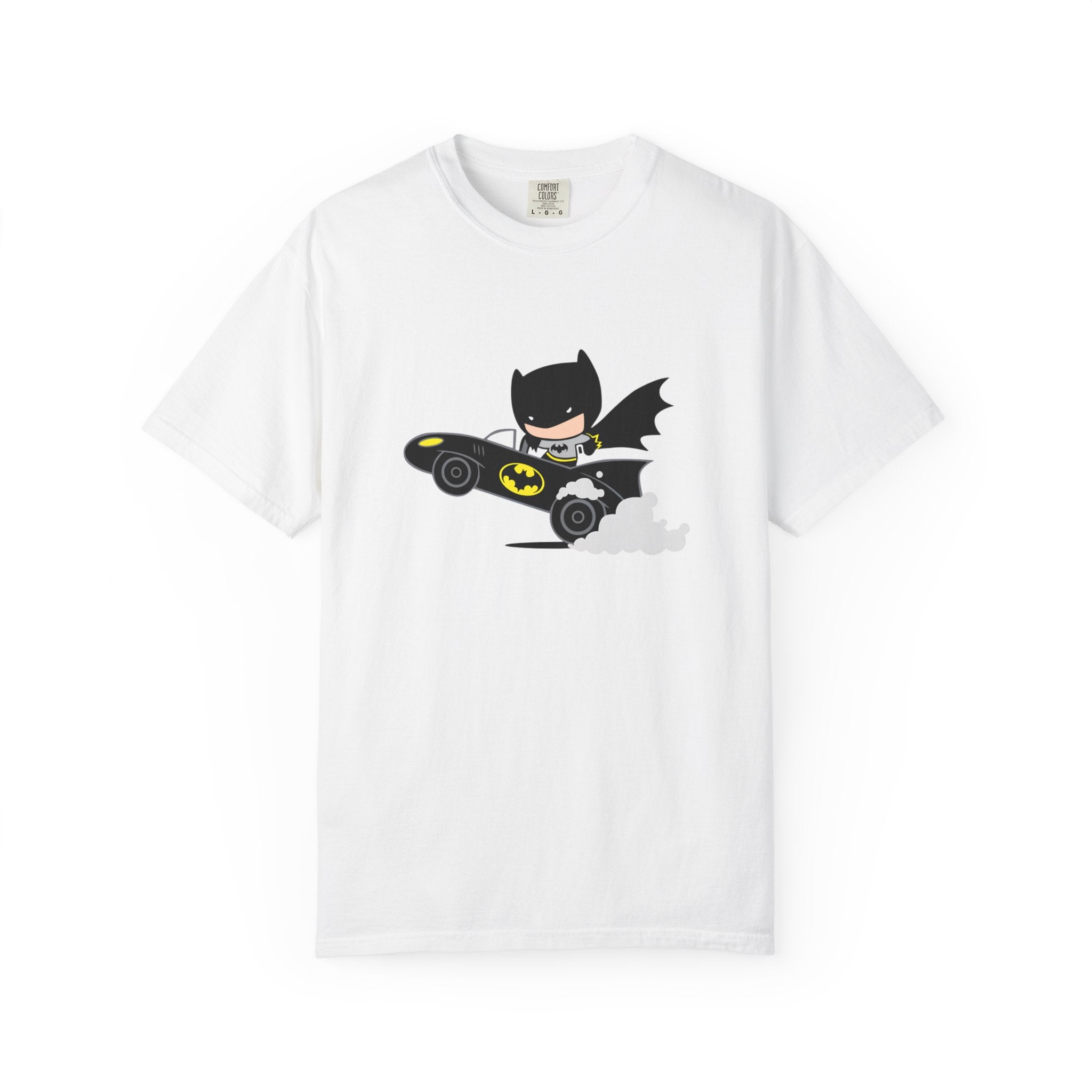 A white short-sleeve crewneck t-shirt featuring a cartoon graphic of Batman driving a black Batmobile with yellow accents, displayed against a clean white background.