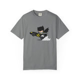 A gray short-sleeve crewneck t-shirt featuring a cartoon graphic of Batman flying in his black Batmobile with yellow accents and white clouds, displayed on a clean white background.