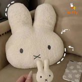 large bunny plush on a sofa