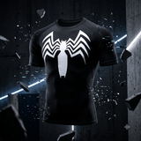 A black short-sleeve athletic t-shirt with a large white spider logo on the chest, shown floating in a dark industrial setting with shattered glass and neon light effects.