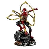 Spider-Man action figure in a red and black suit with gold web-like loops, posed crouching on a dark mechanical base against a clean white background.