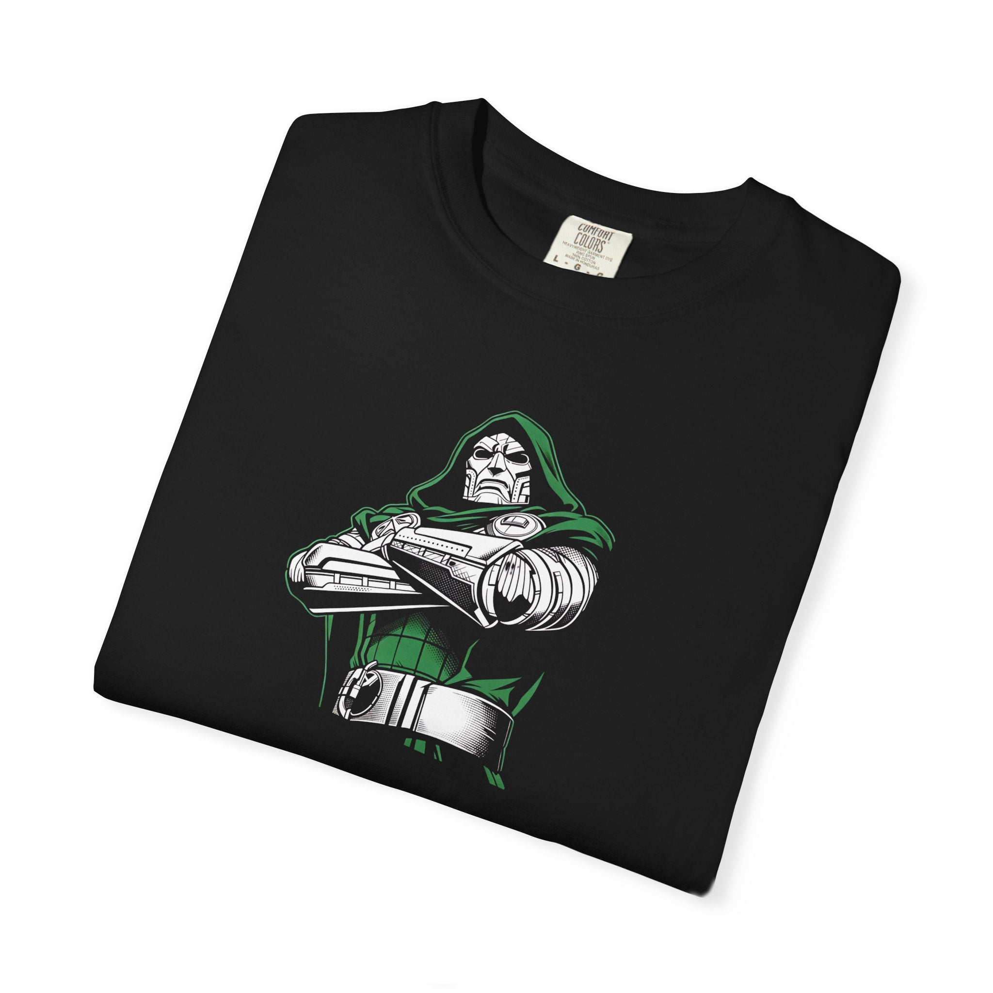 A folded black t-shirt featuring a graphic print of the Marvel character Doctor Doom with crossed arms, wearing green and silver armor. The shirt is displayed on a clean white background.