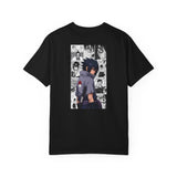 A black short-sleeve crewneck t-shirt featuring a large rectangular anime graphic print on the front. The graphic depicts a character in profile with a red leaf symbol on his shoulder, set against a background of black-and-white manga panels.