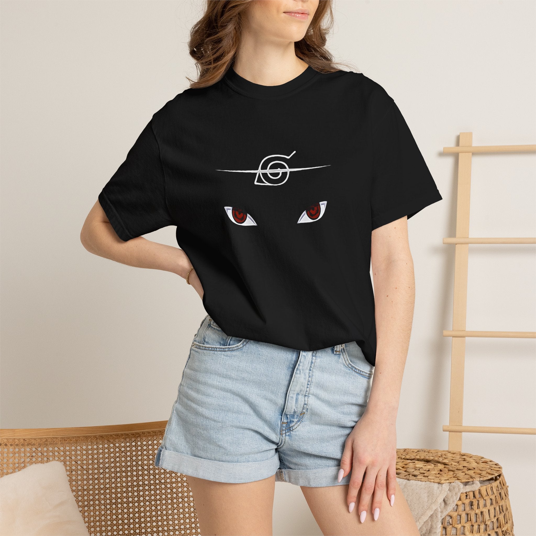Person wearing a black t-shirt with 'nurse' printed on it and denim shorts.