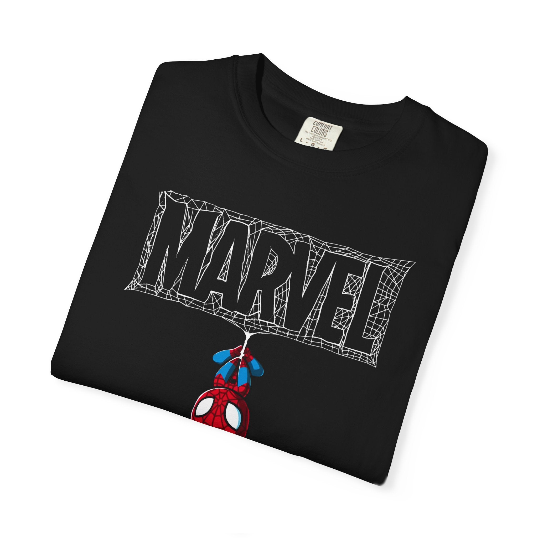 A folded black Marvel t-shirt featuring a white webbed 'MARVEL' graphic and a small Spider-Man character hanging below, displayed on a clean white background.