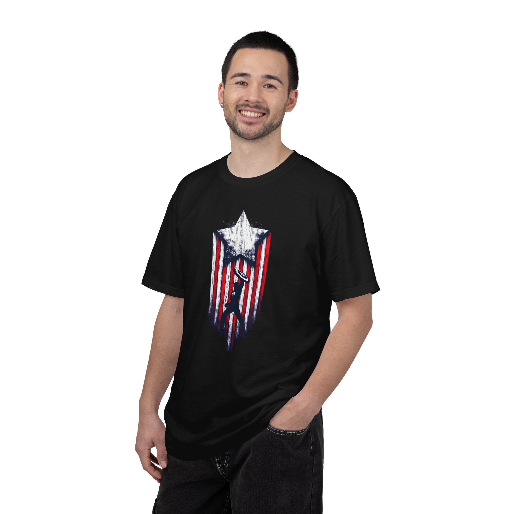 A man wearing a black crewneck t-shirt with a distressed red, white, and blue shield graphic on the chest, set against a plain white background.