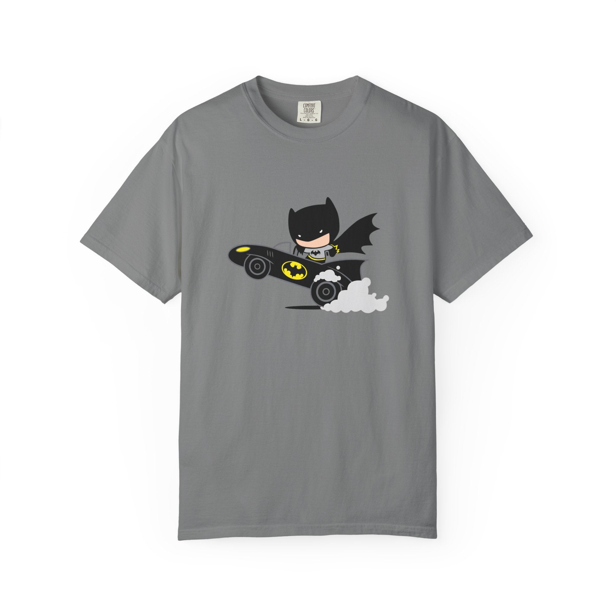 A gray short-sleeve crewneck t-shirt featuring a cartoon graphic of Batman flying in his black Batmobile with yellow accents and white clouds, displayed on a clean white background.