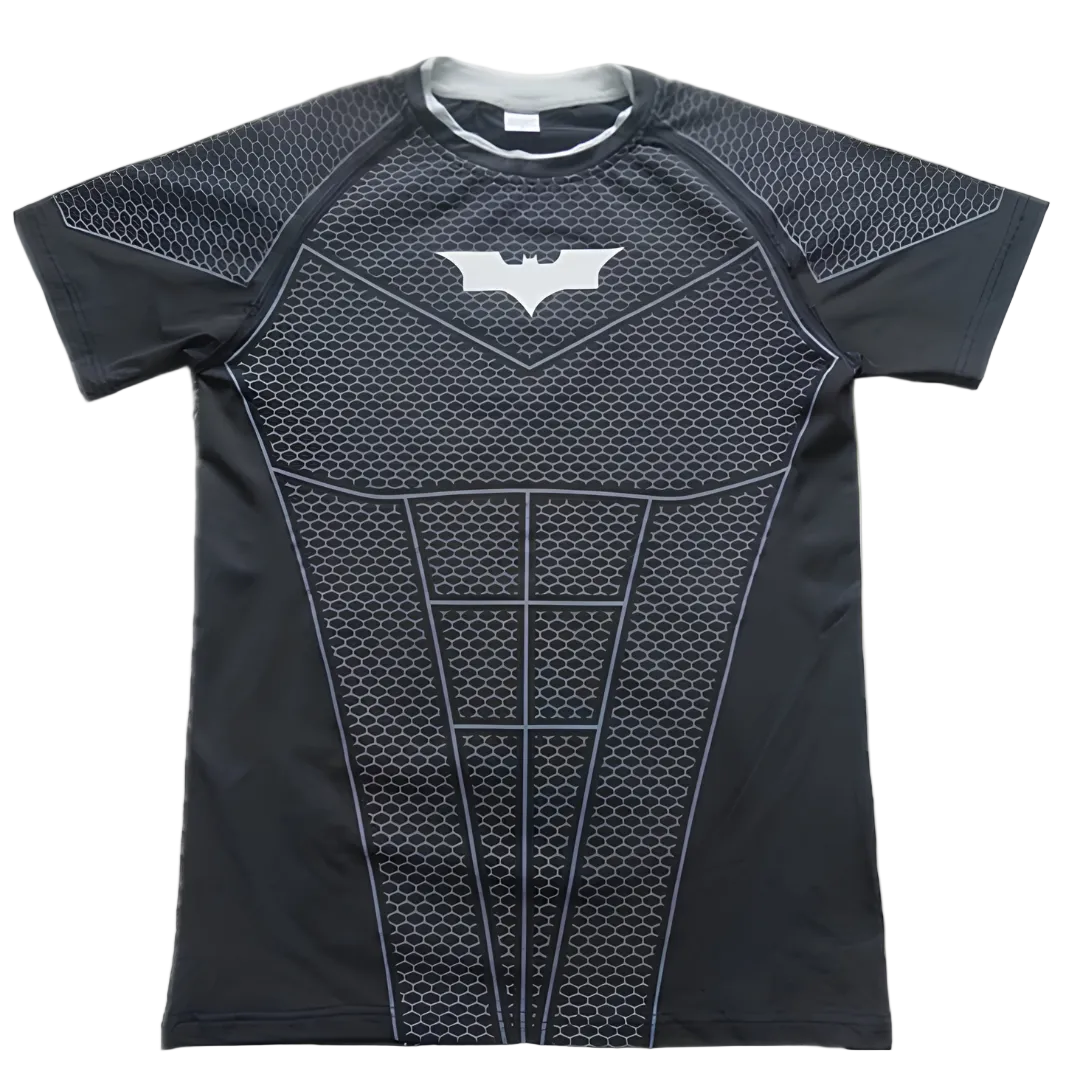A short-sleeve athletic compression shirt styled like Batman's armor, featuring a black and dark gray honeycomb pattern with a white bat symbol on the chest, shown flat on a white background.