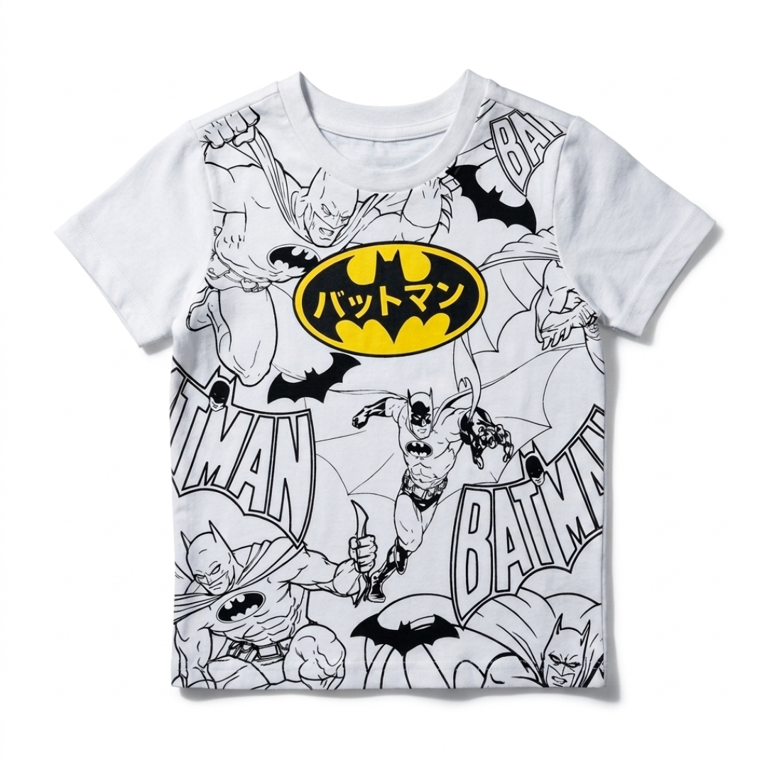 A white short-sleeve kids' t-shirt featuring a black and white comic-style Batman collage print with a prominent yellow oval Batman logo on the chest containing Japanese text.