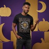 A man wearing a black graphic t-shirt with a 'WAKE AND BE FOREVER' design inspired by The Lion King, posed against a purple and gold Halloween-themed backdrop with pumpkins and crescent moons.