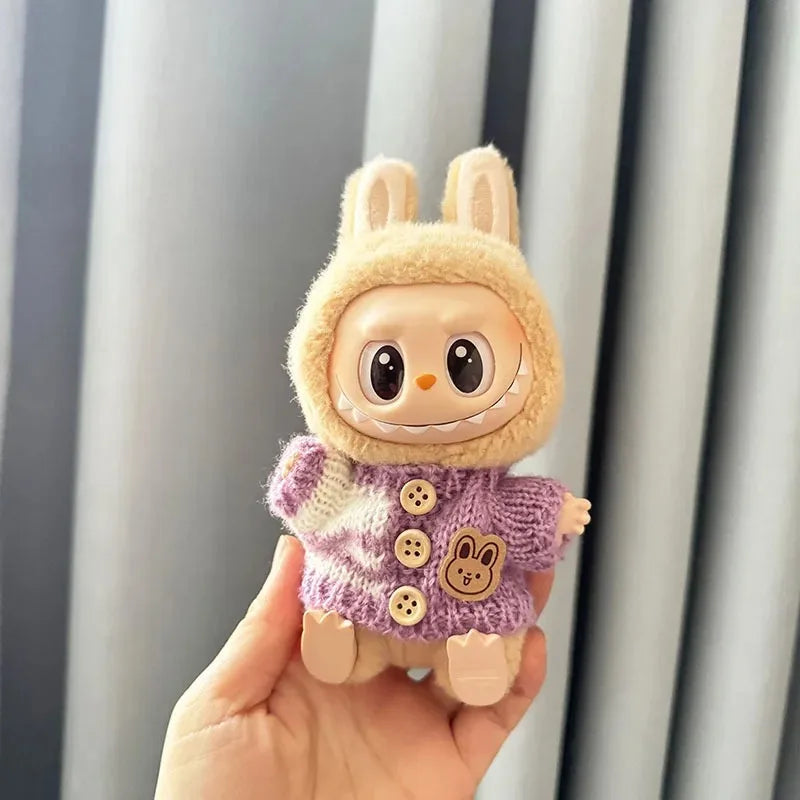Mini Labubu plush toy in purple bunny-themed sweater