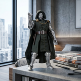 A collectible action figure of Doctor Doom stands on a concrete table in a modern room with a city skyline view. The figure is dressed in a dark green hooded cloak and metallic silver armor, with one hand raised.