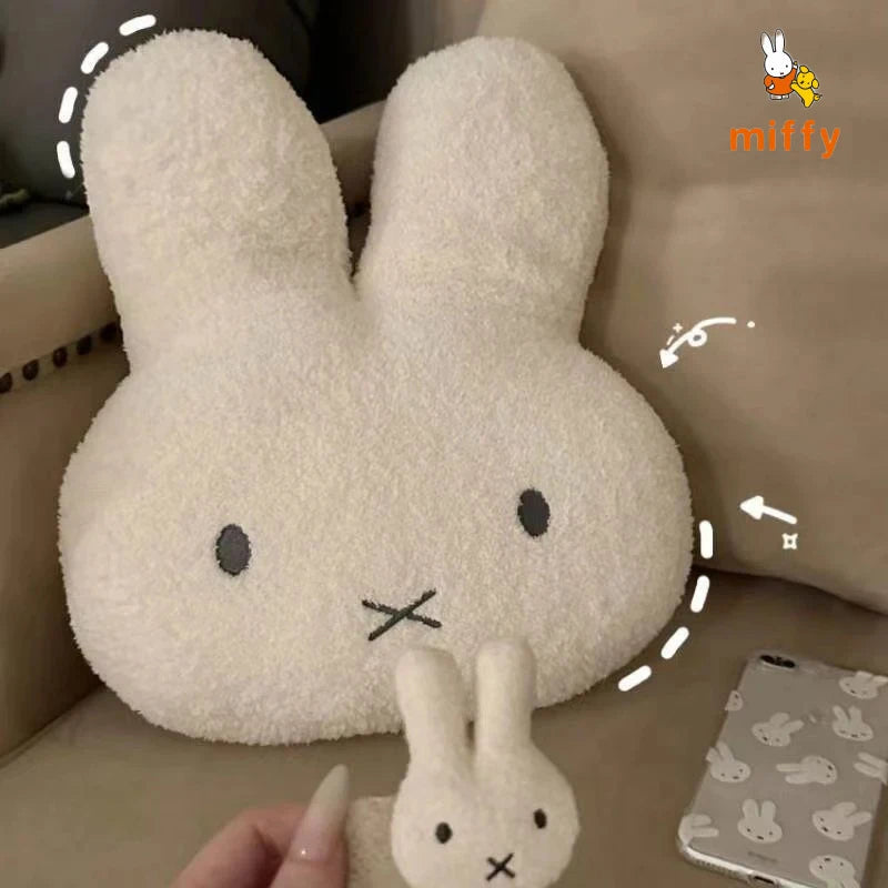 large bunny plush on a sofa 