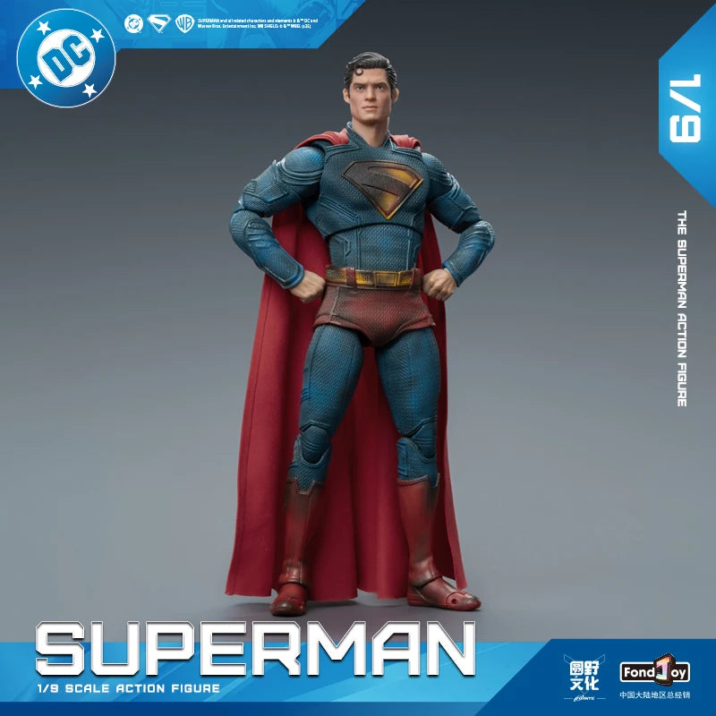 Superman action figure with red cape and blue suit on a gray background, featuring DC logo.