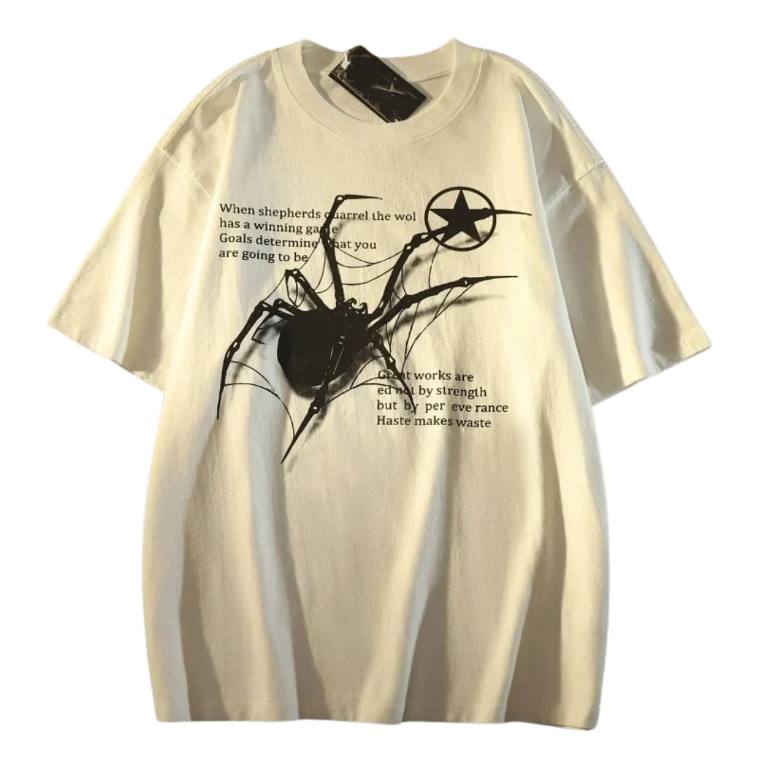 An oversized cream-colored t-shirt featuring a black spider graphic and text on the front, displayed flat against a white background.