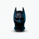 A glossy black and dark teal Batman cowl mask centered on a clean white background.