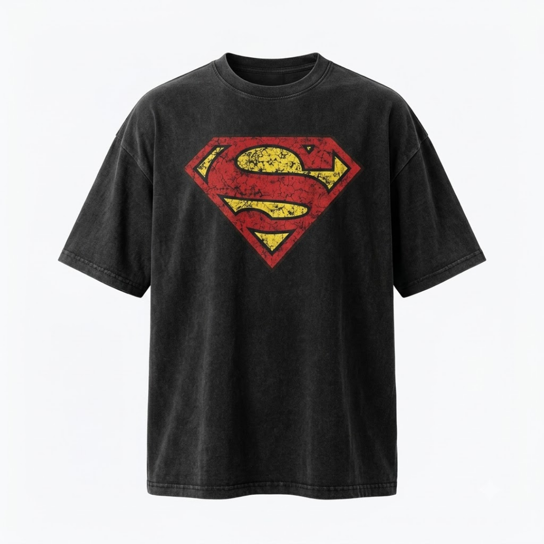 A black washed short-sleeve t-shirt featuring a distressed red and yellow Superman logo on the chest, displayed against a clean white background.