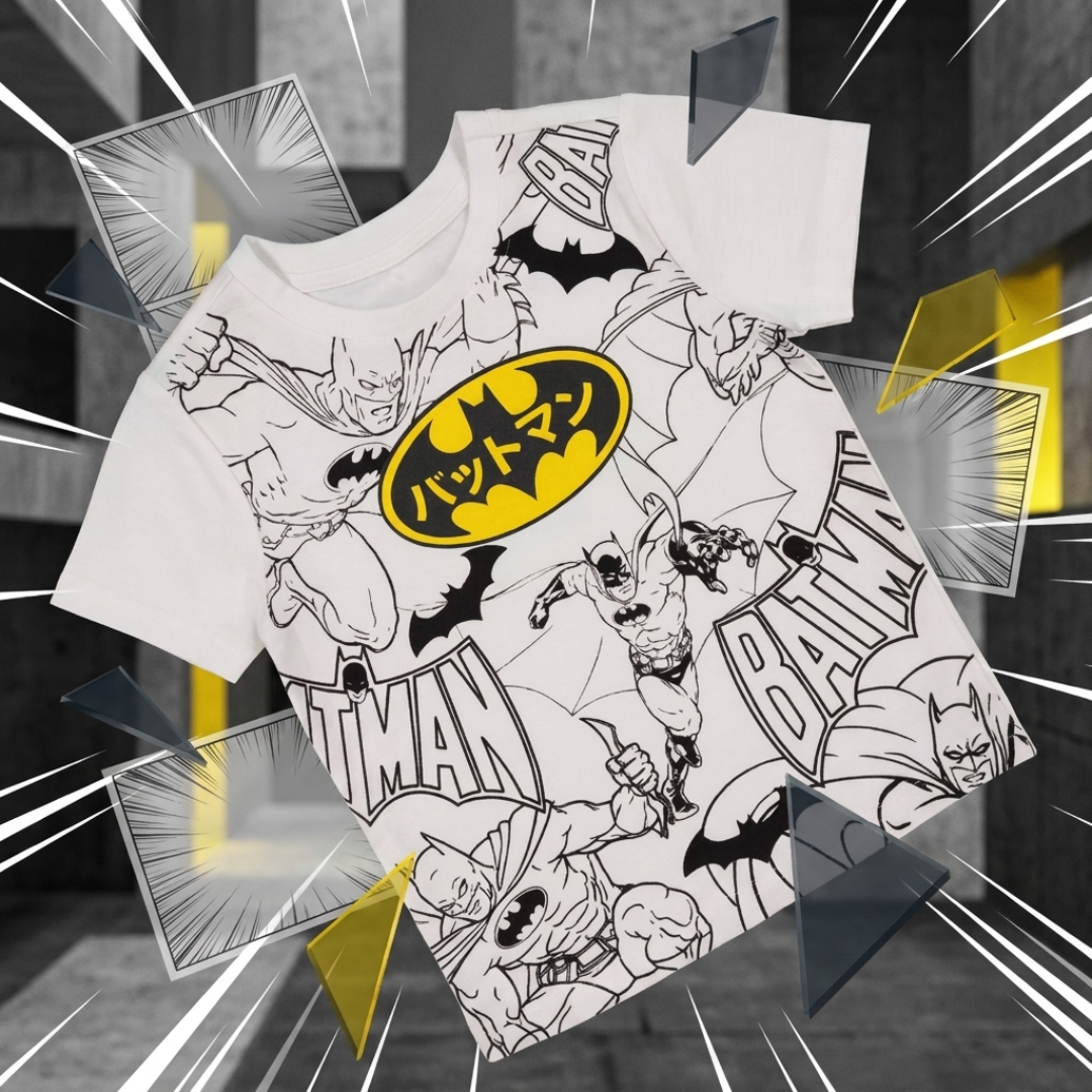 A white short-sleeve Batman graphic T-shirt with black comic-style artwork and a large yellow Batman logo on the chest, shown floating over a dark gray illustrated background with comic-panel overlays.