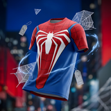 A Spider-Man themed short-sleeve t-shirt with a red and blue color-blocked design and a large white spider emblem on the chest, shown floating against a blurred city background with web graphics and hang tags.